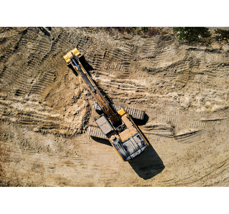 Gul grävmaskin arbetar fototapet - Tenstickers